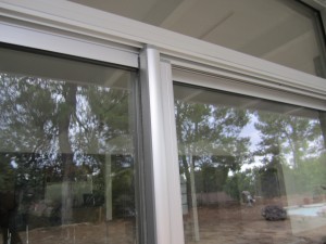 Encino installation of Clear Anodized Retractable Screen Door for a patio sliding screen door